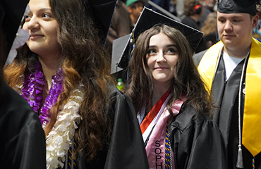  Graduate walking in to ceremony